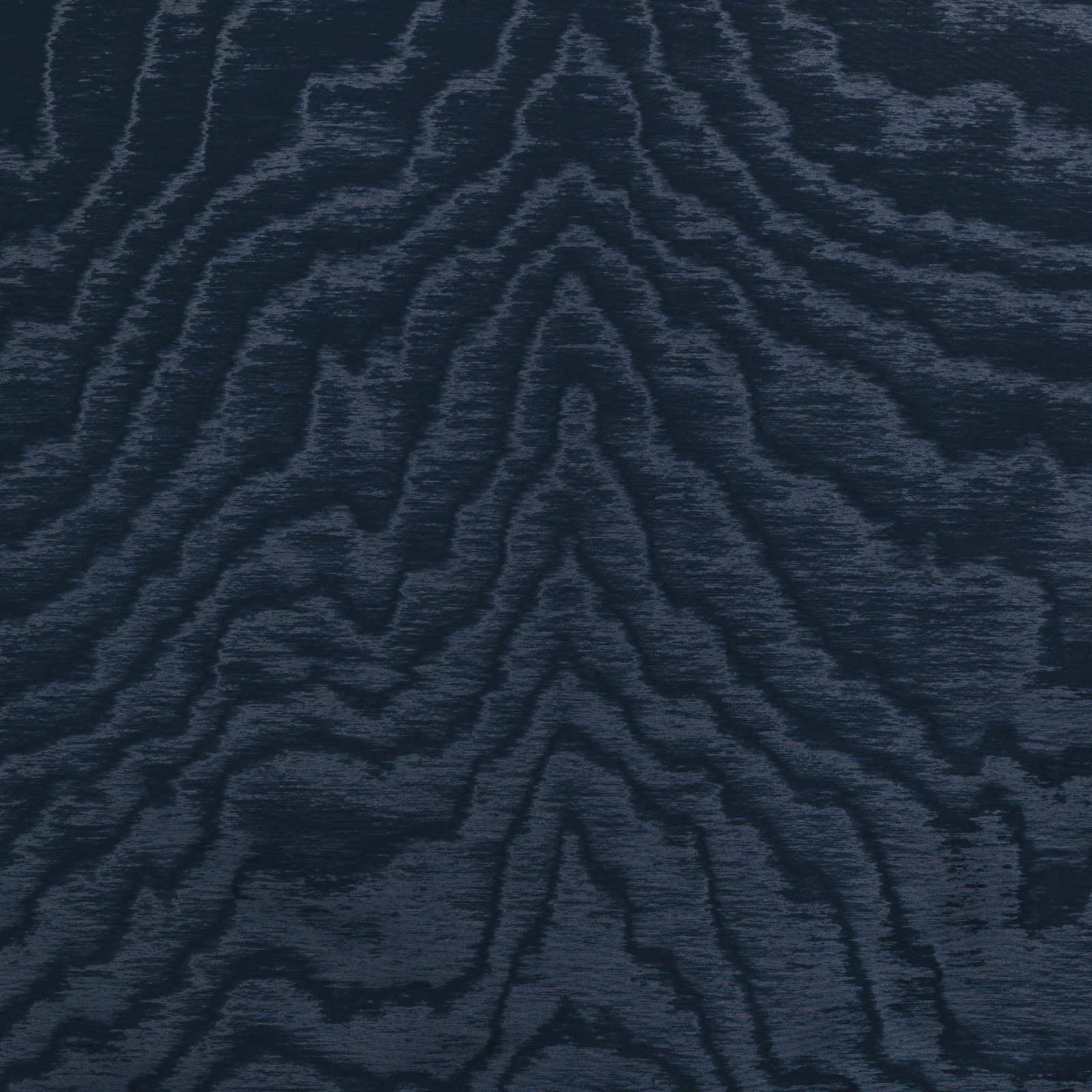 Deep navy-charcoal textile with slate woodgrain lines across a softly ribbed surface