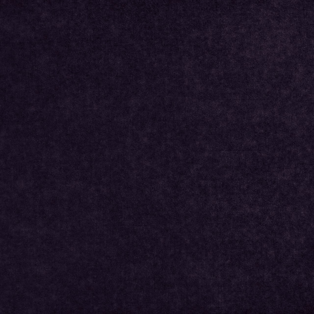 Deep charcoal-aubergine fabric with a softly mottled, low-sheen plush texture