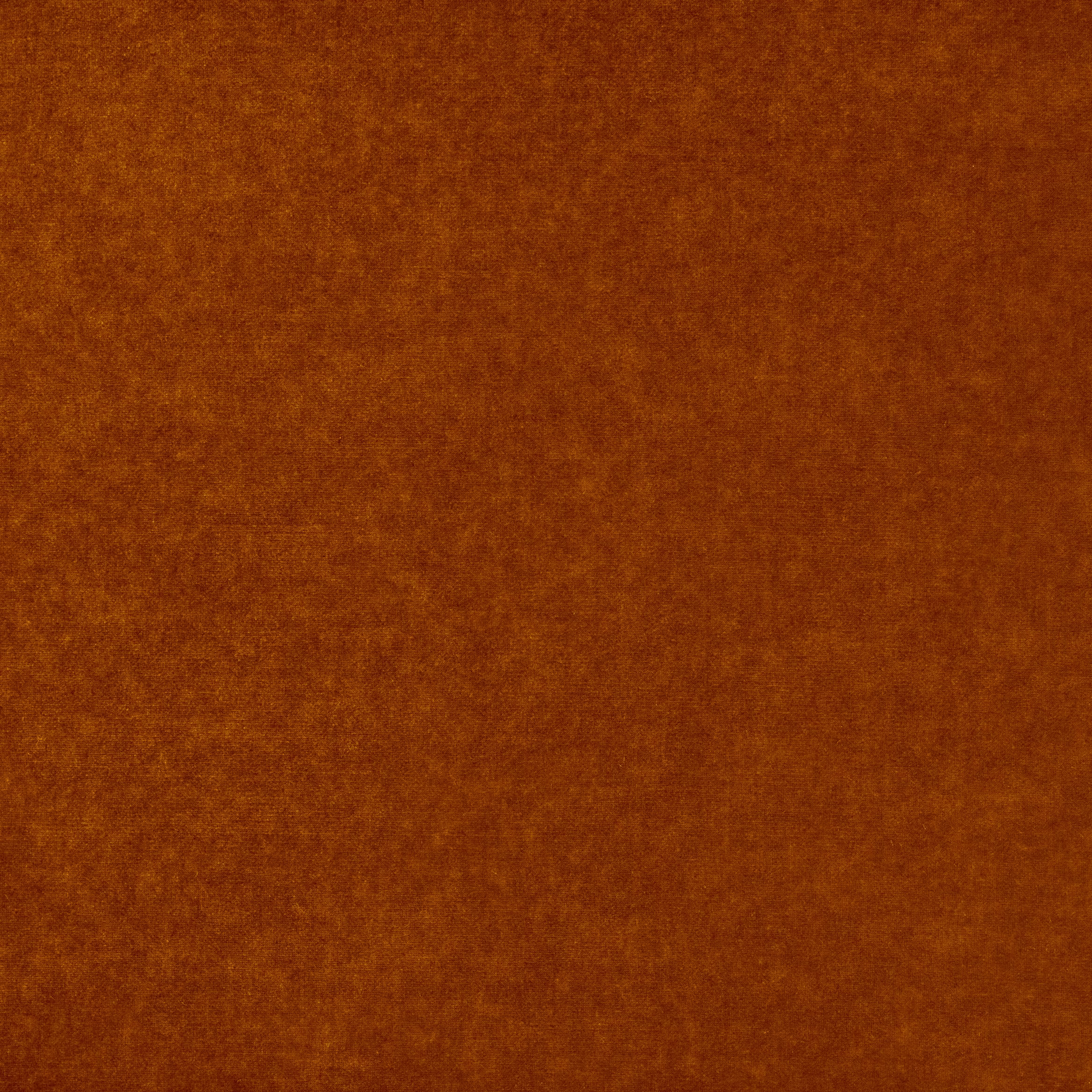 Warm rust-orange fabric with a softly mottled, plush-looking surface