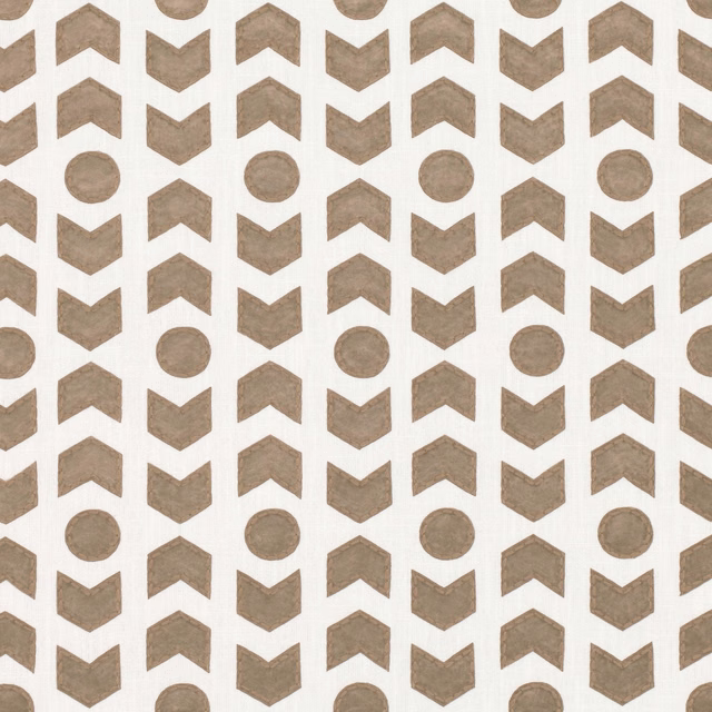 Tobacco arrowheads and round motifs on a softly textured ivory fabric ground
