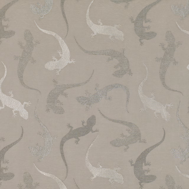 Warm taupe woven fabric with ivory and grey salamander motifs and curling tails