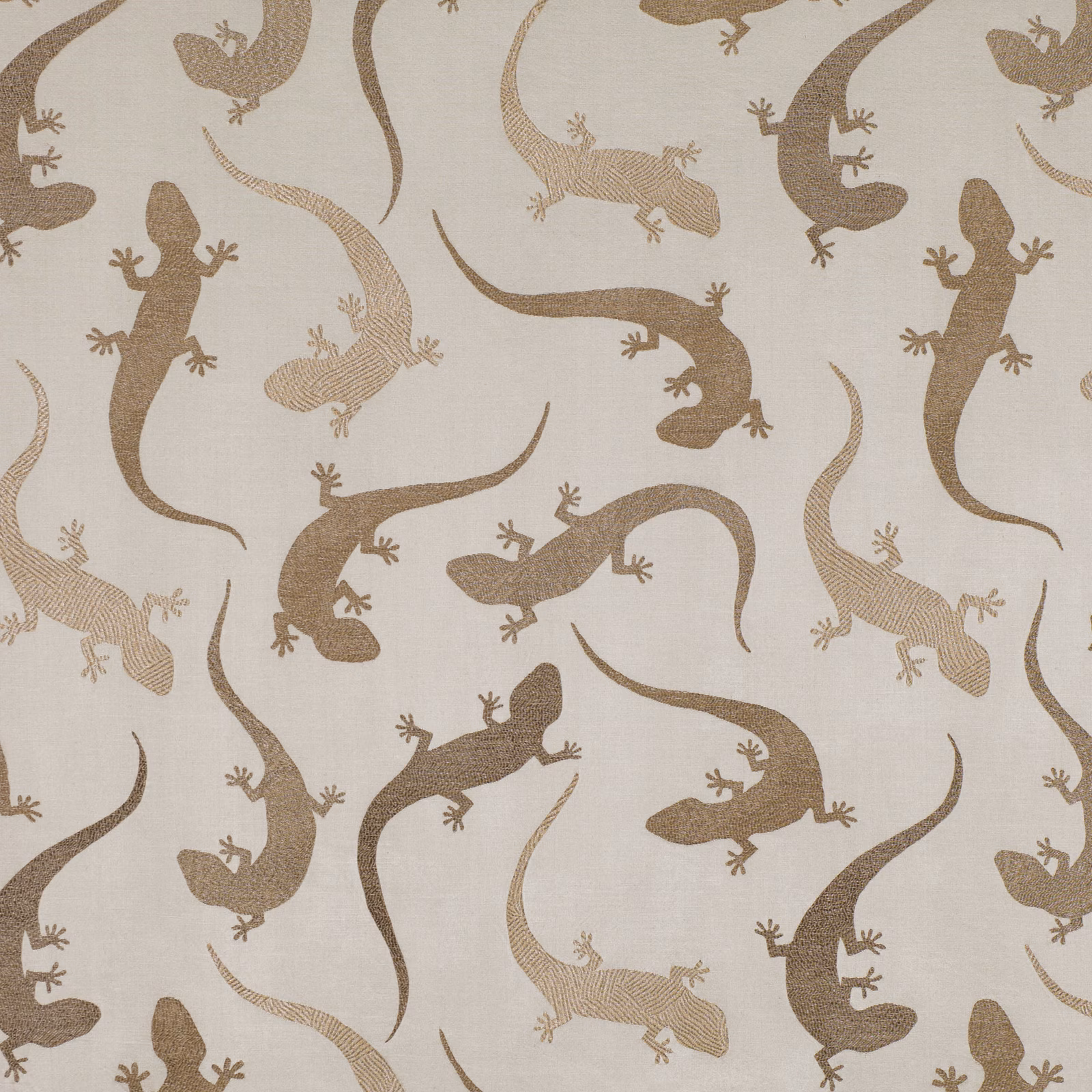 Cream textured fabric with scattered tobacco-brown salamanders and curling tails