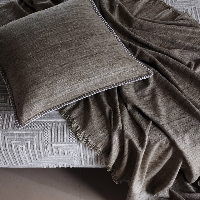 Taupe-brown Tanit Cobblestone textile with fine striations and softly lustrous folds