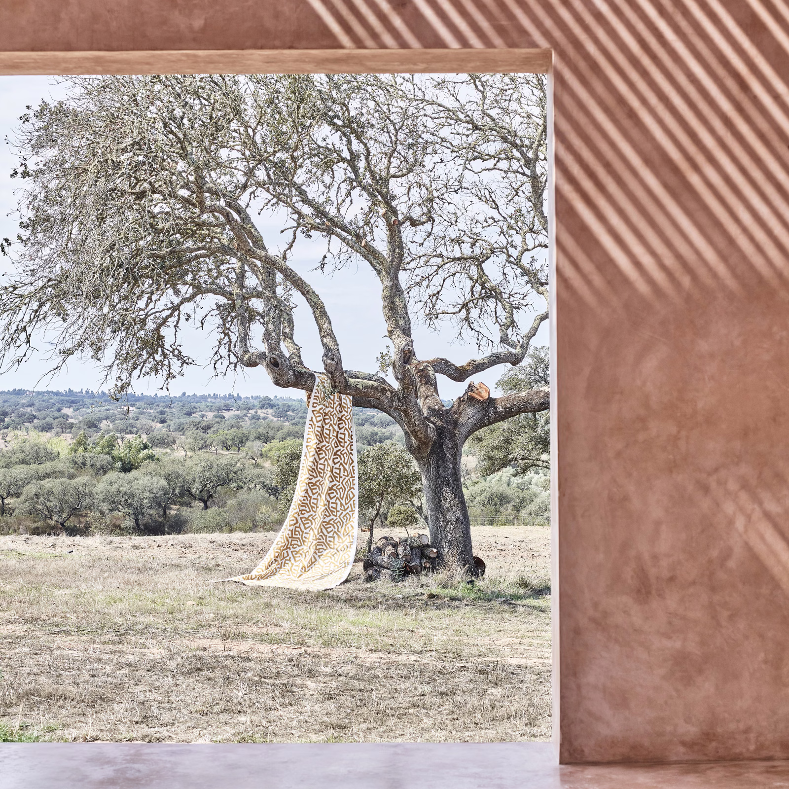 Warm ochre fabric with pale diagonal stripes and softly brushed tonal texture
