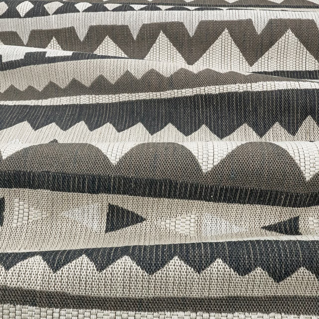 Charcoal and greige woven geometric bands with zigzags, scallops and triangles