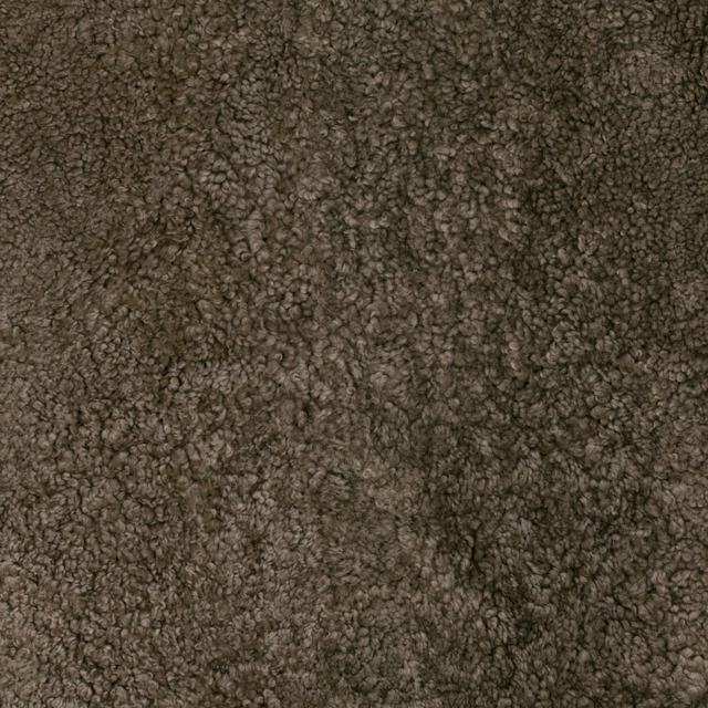 Deep warm taupe fabric with dense curly pile and softly shadowed texture