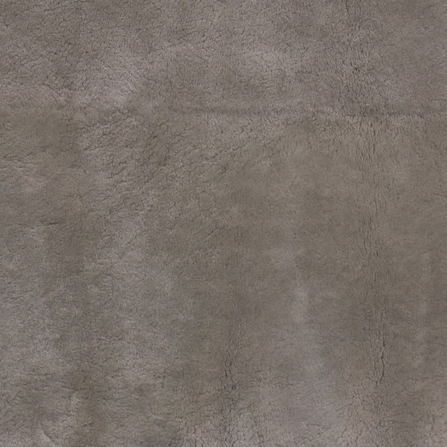 Warm taupe-grey Shornsheepskin fabric with dense mottled short-pile texture