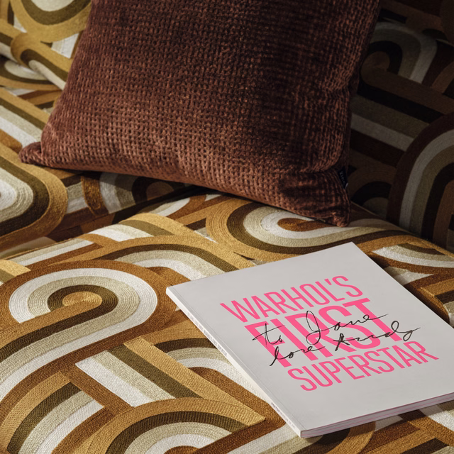 Cognac brown textured upholstery with cream, camel and deep brown retro swirl bands