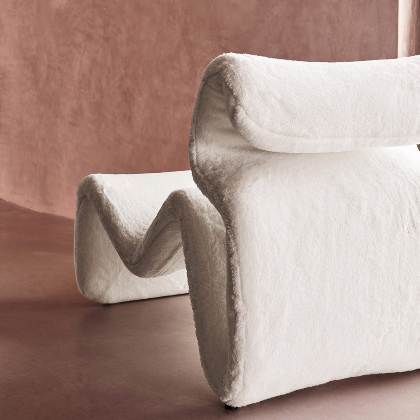Warm chalk-white bouclé fabric folded into thick sculptural rolls with a nubby surface
