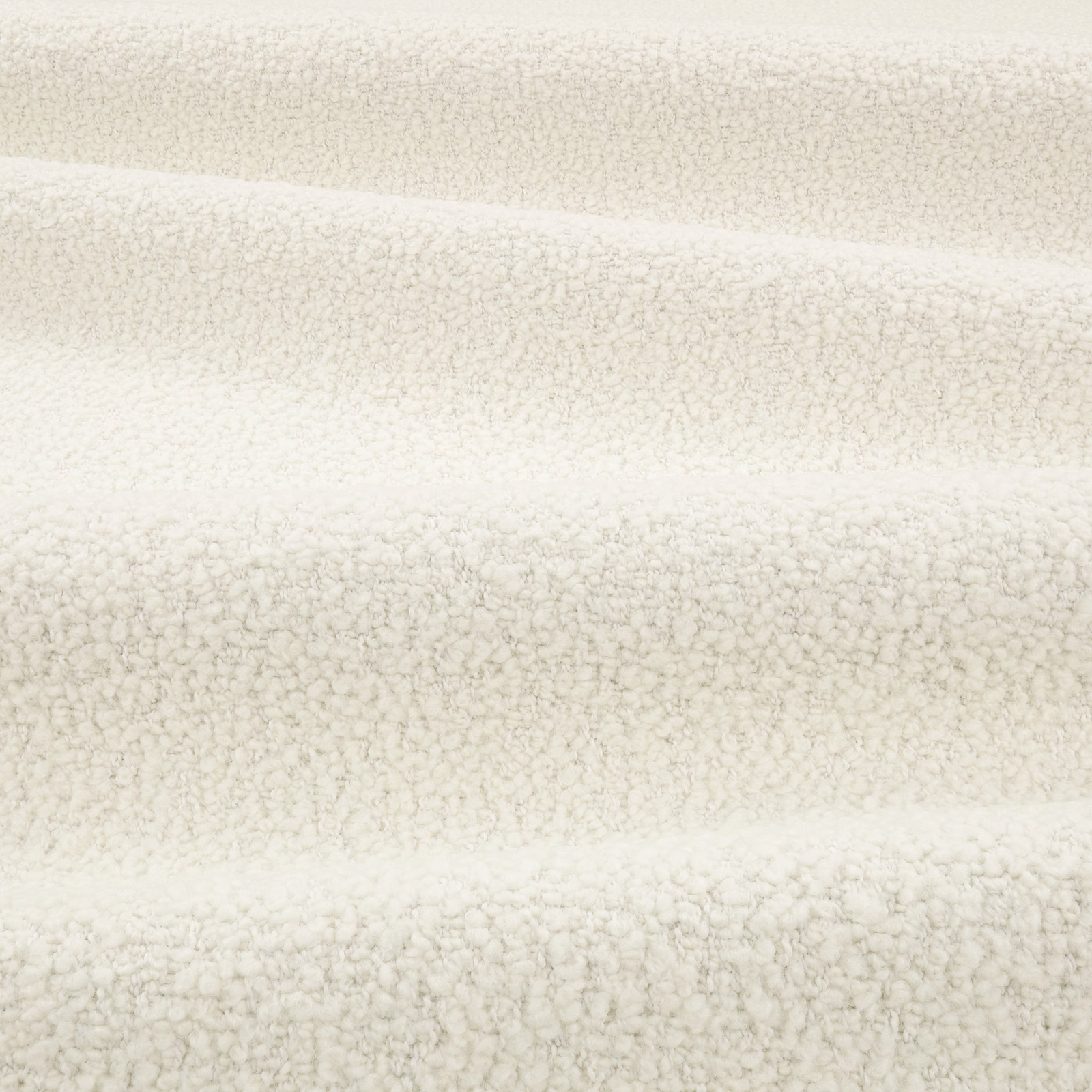 Warm bone bouclé fabric with dense irregular loops and soft horizontal folds