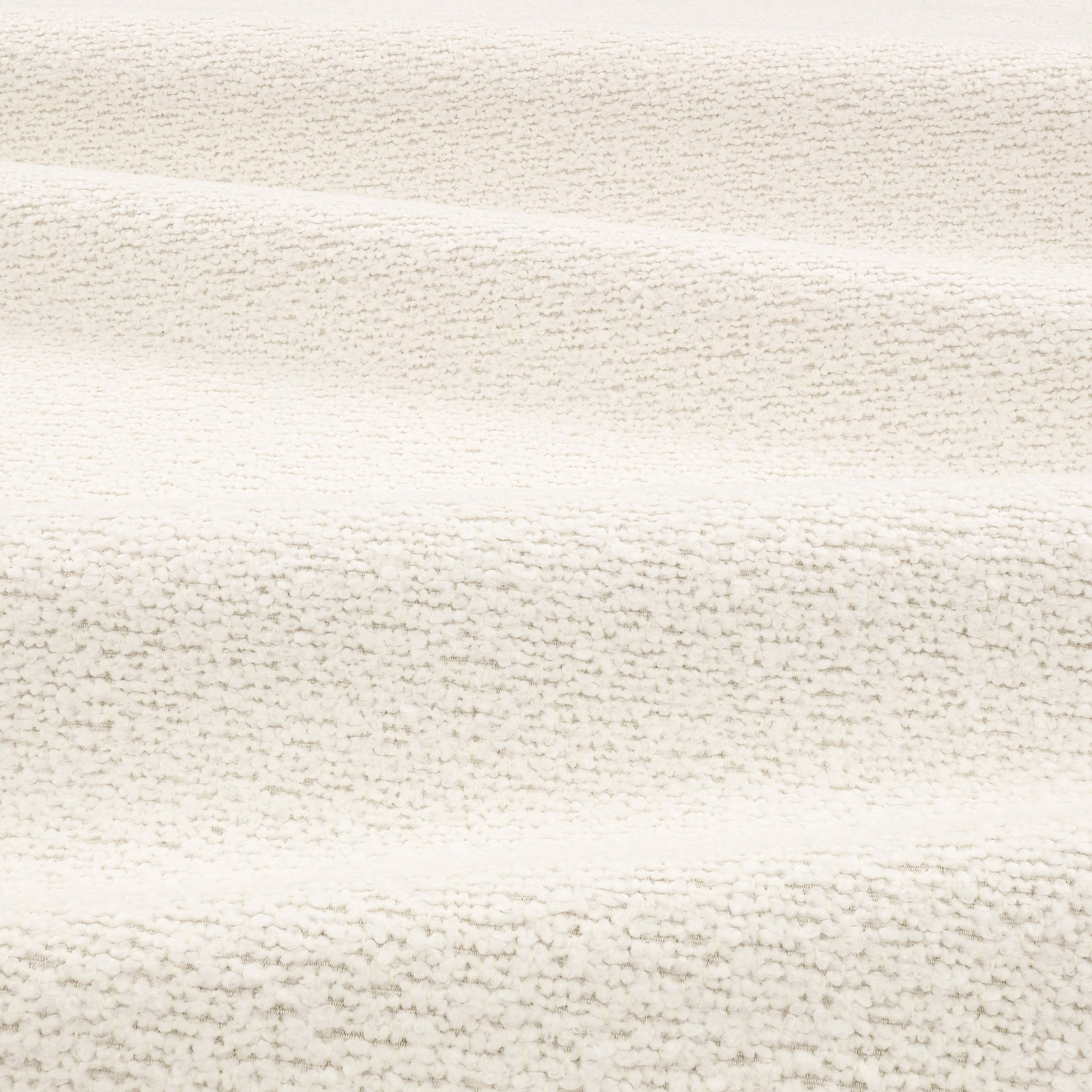 Chalk cream bouclé swatch showing irregular nubby rows and softly folded highlights