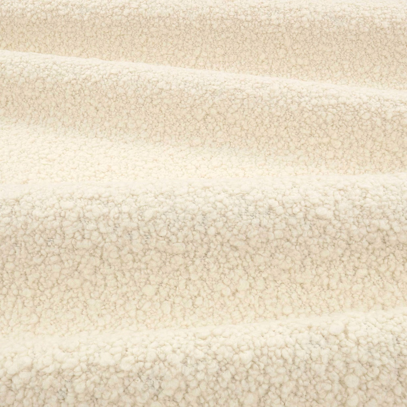 Warm vanilla ivory boucle with fine beige flecks and a softly looped pile