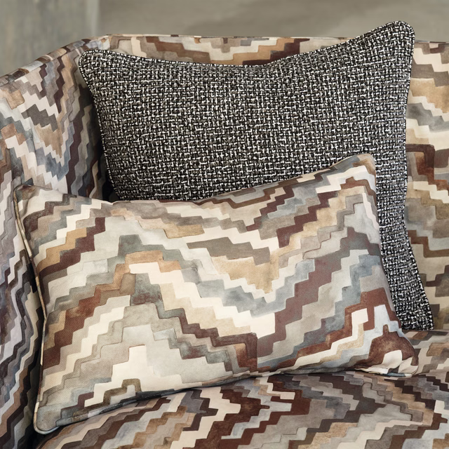 Warm taupe zigzag upholstery with cream, brown and blue-grey stepped motifs