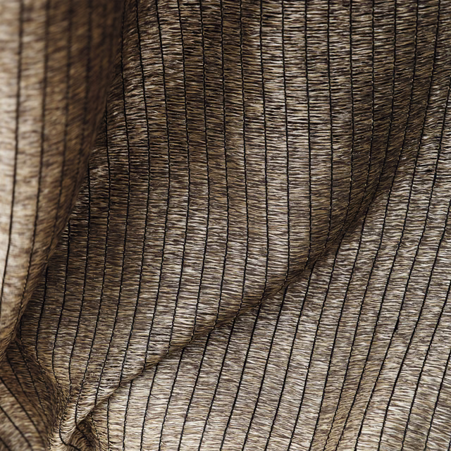 Warm gold-sand sheer with dark pinstripes and softly rippled translucent texture