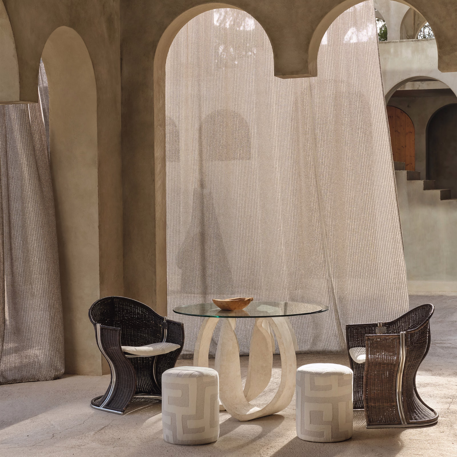 Warm taupe sheer fabric with fine vertical striations filtering light through arched windows