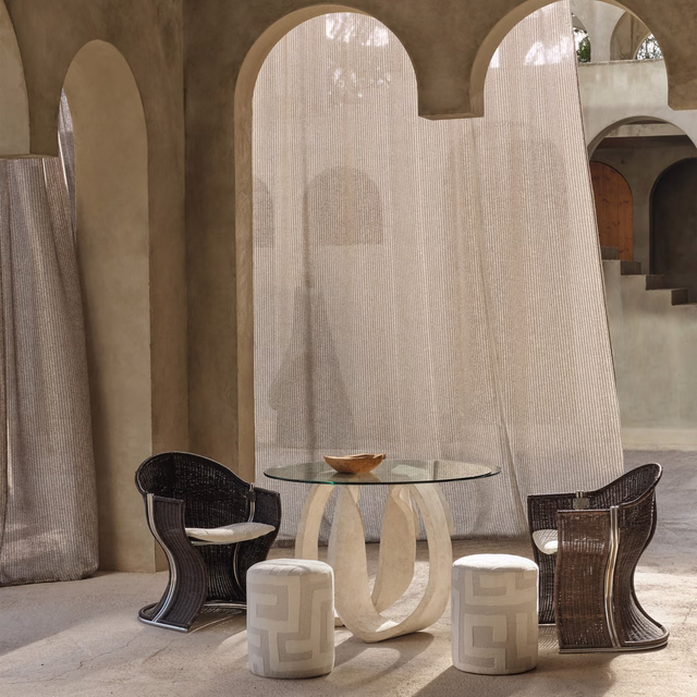 Warm taupe sheer fabric with fine vertical striations filtering light through arched windows