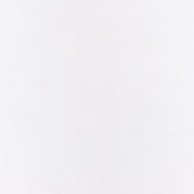Near-white sheer with faint cloudy striations and a softly luminous surface