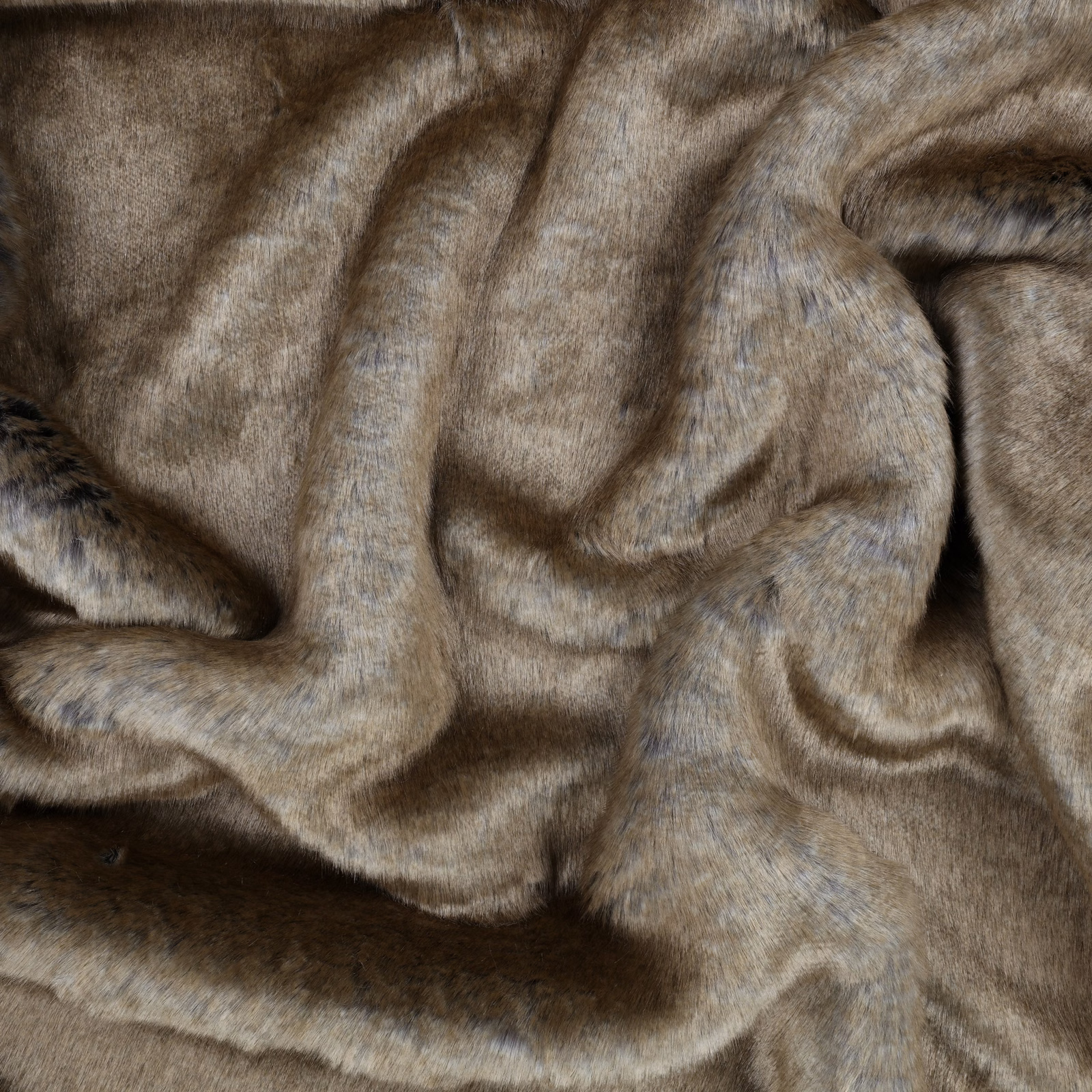 Smoky taupe-brown plush fabric with blue-grey highlights folded into soft waves
