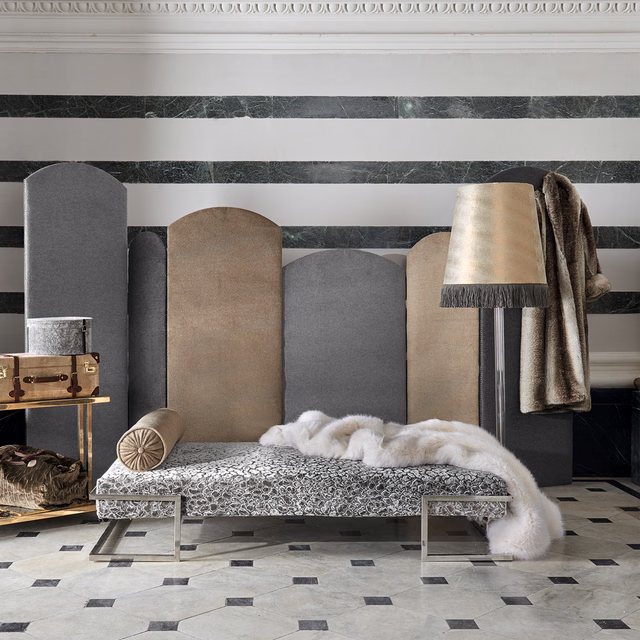 Mottled taupe-grey plush textile hanging beside a striped upholstered screen