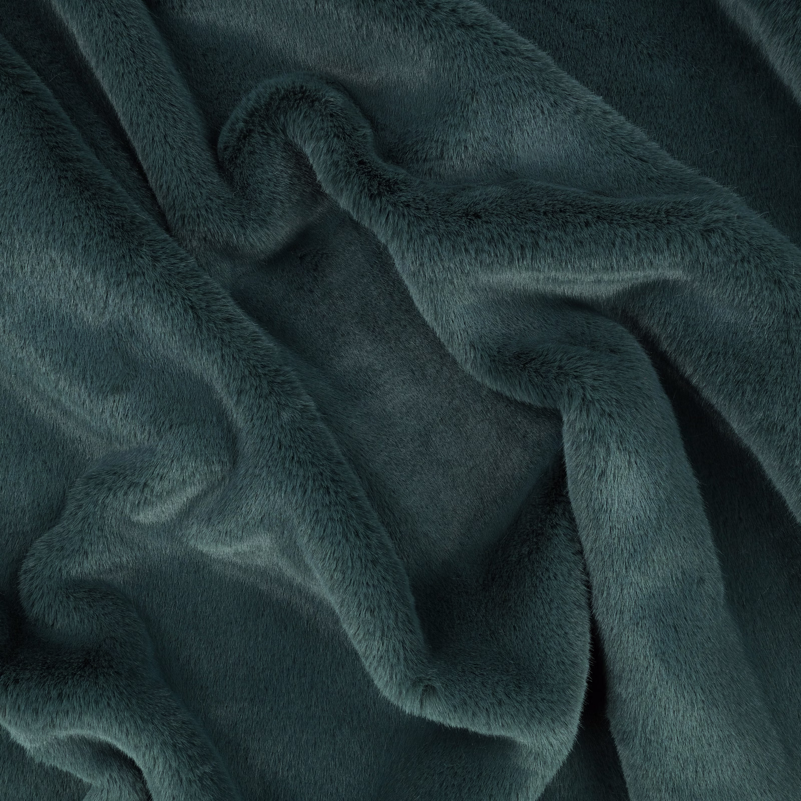 Deep blue-green plush pile gathered into softly reflective folds