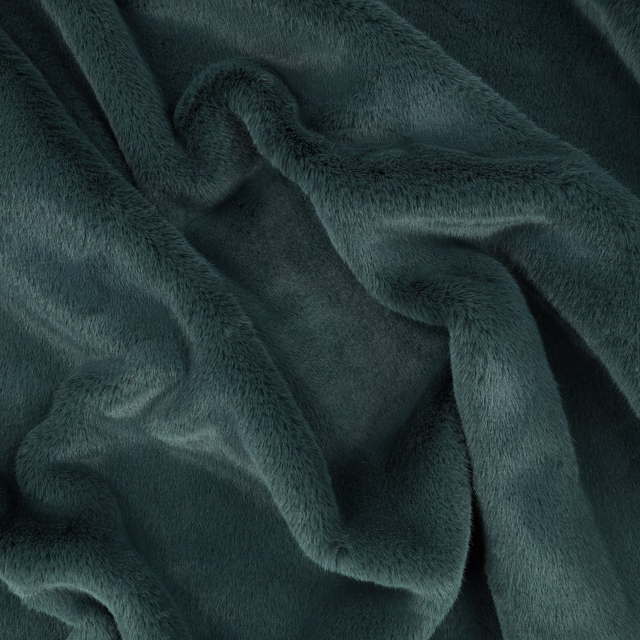 Deep blue-green plush pile gathered into softly reflective folds