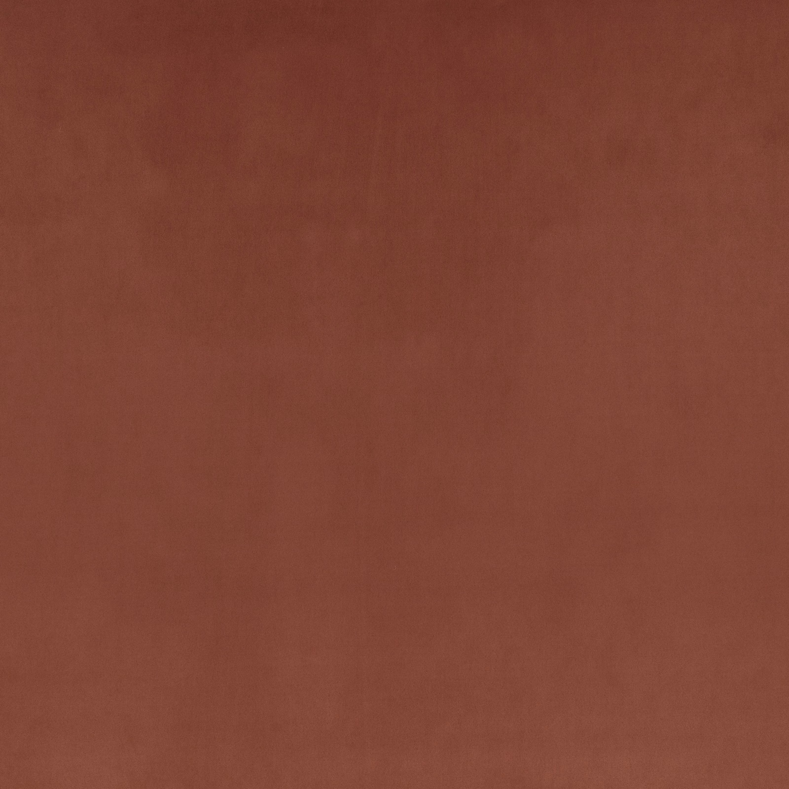 Warm terracotta-brown suede surface with subtle nap variation and soft vertical shading