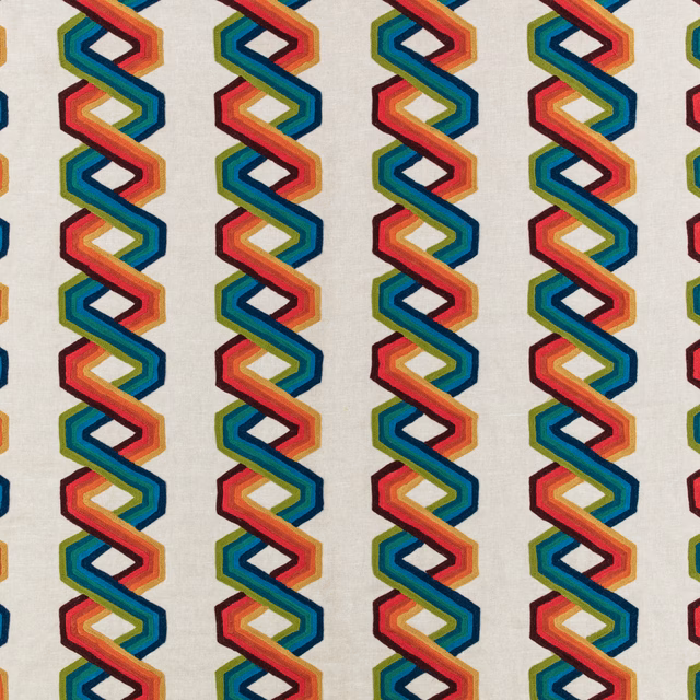 Cream textile with repeating multicoloured interlocking zigzag columns and fine woven texture