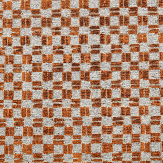 Warm cognac-brown woven blocks scattered across a pale grey textured ground