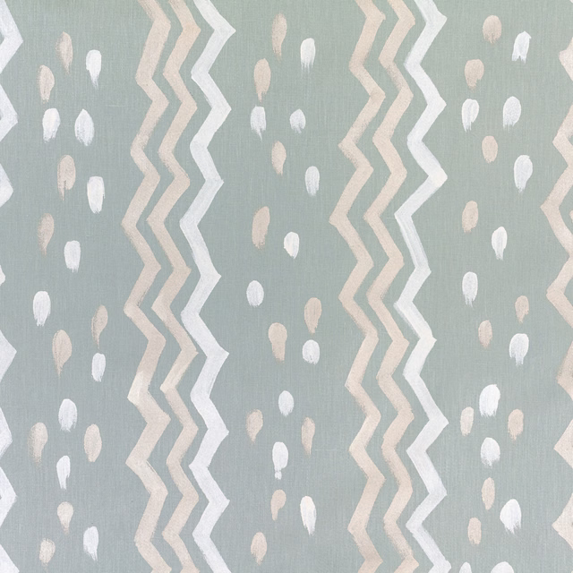 Cool seafoam fabric with cream zigzag bands and scattered blush marks