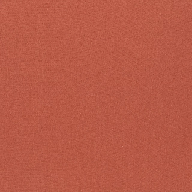 Warm brick-terracotta plain fabric with a fine, softly textured weave