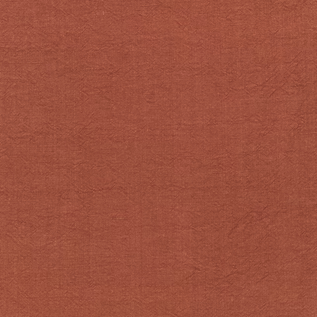 Close-up of warm terracotta-brown woven textile with subtle tonal mottling