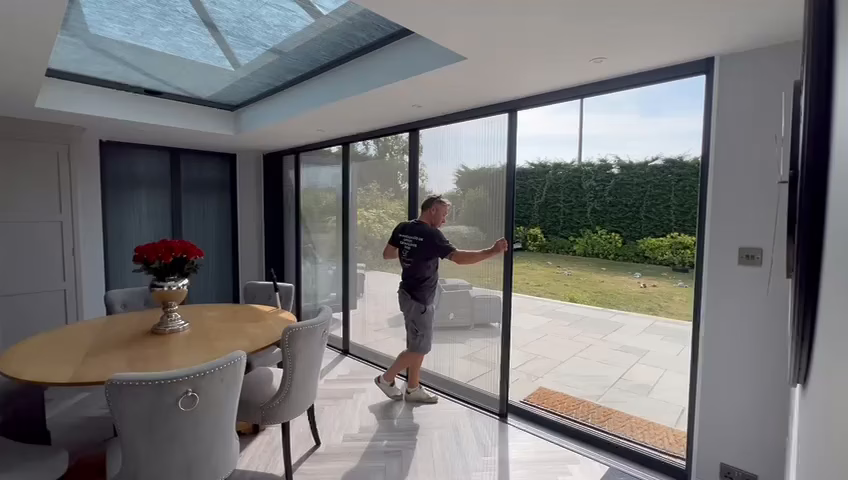A Blindscreen unit pulled across a run of bi-fold doors