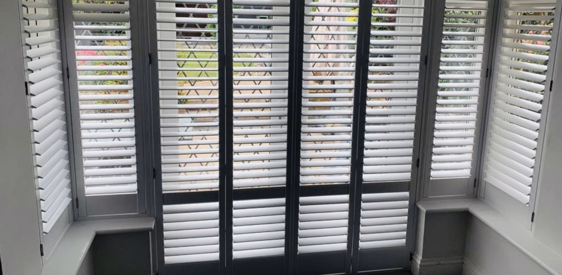 Shutters fitted to a bay window