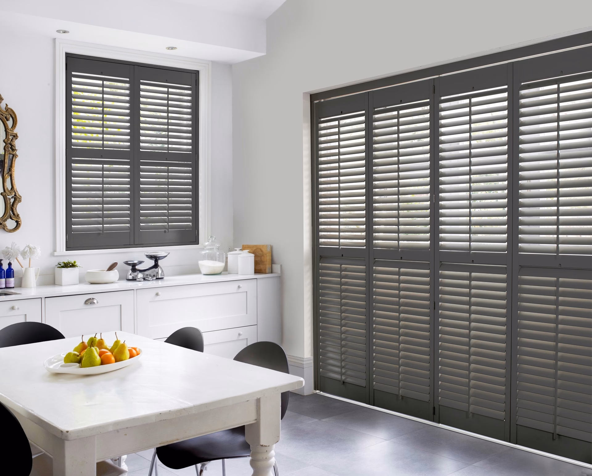 Tracked full-height shutters drawn across a wide opening